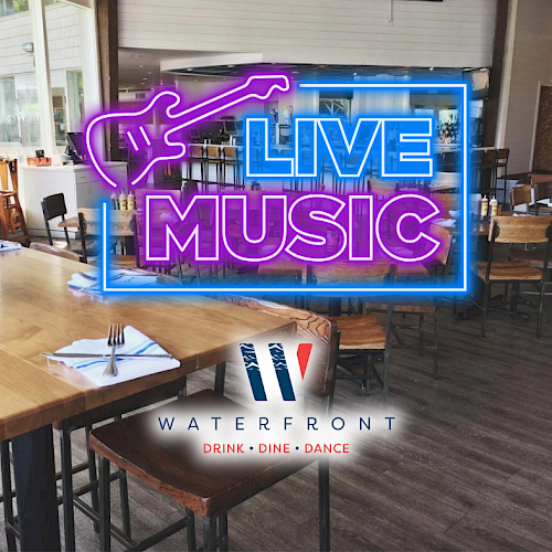 An empty restaurant with a neon sign reading 