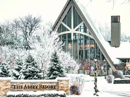 A snow-covered resort with a prominent sign reading 