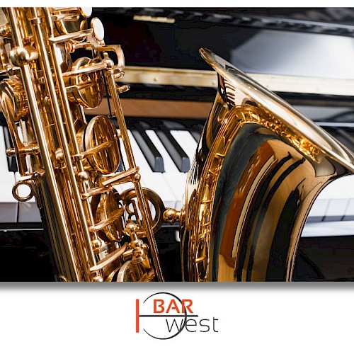 A saxophone and a piano keyboard are shown in the image, with a logo for 