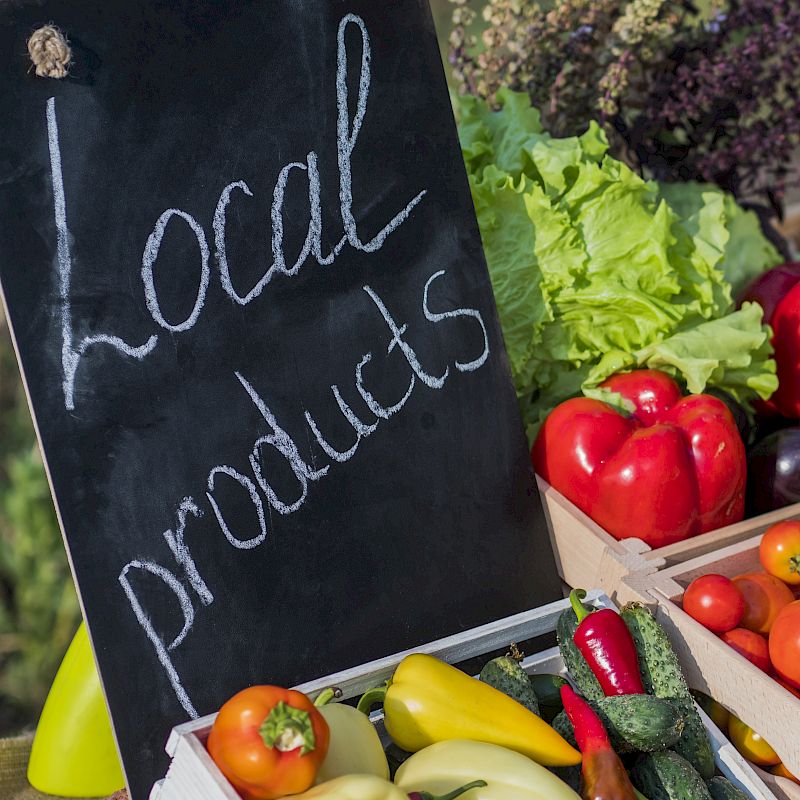 A display of fresh vegetables with a sign that reads 